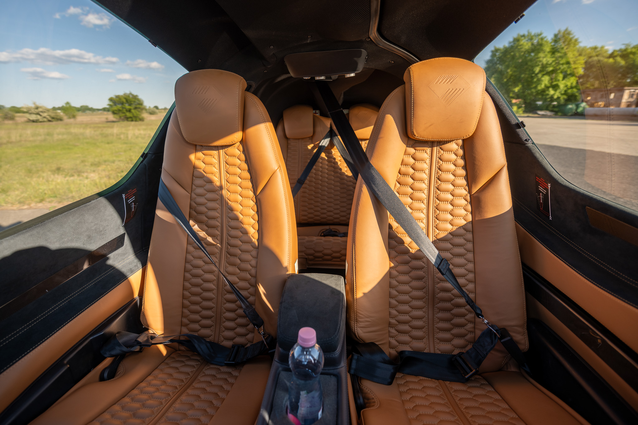 Tan leather passenger seats inside HA-BJM