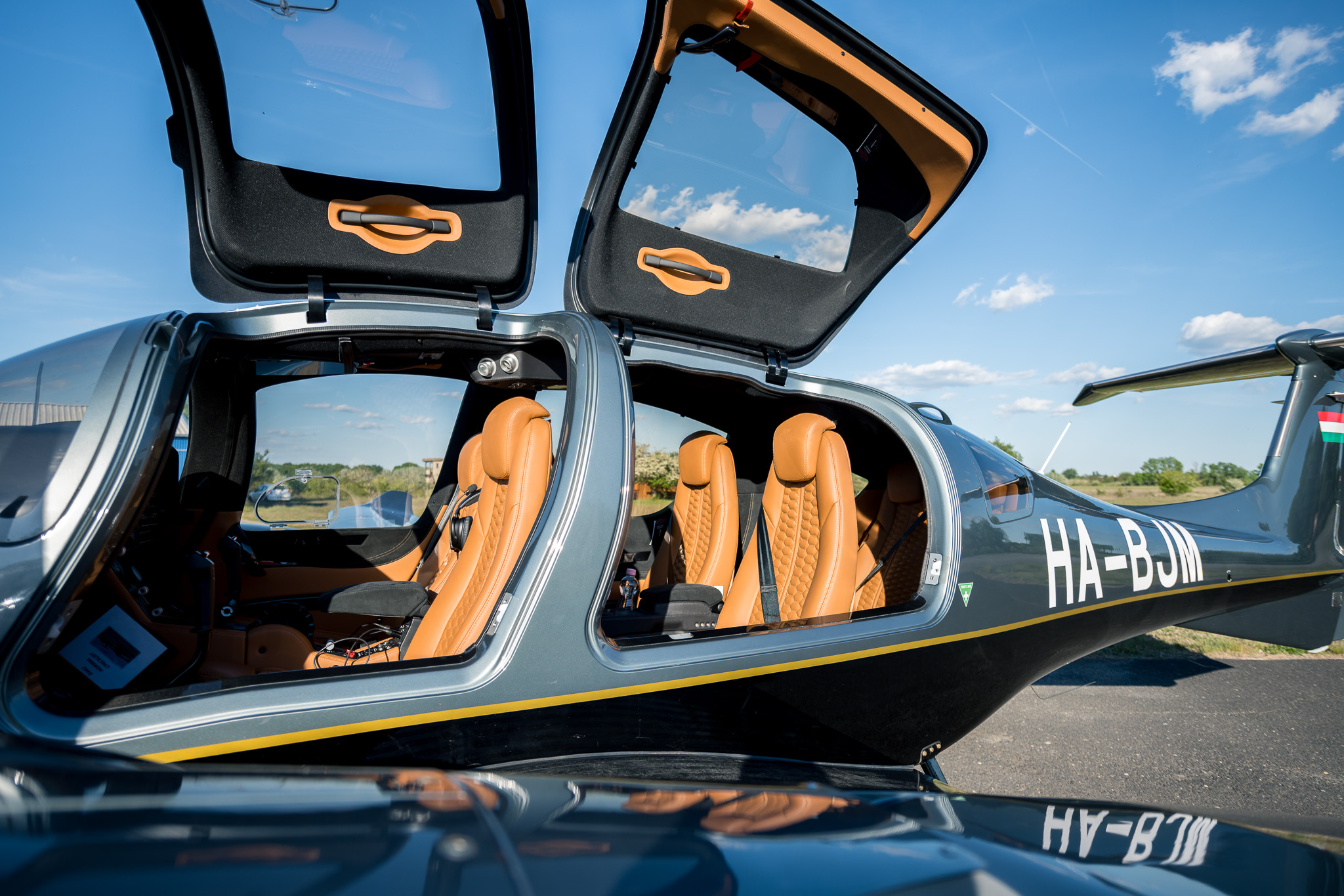 HA-BJM with its front and rear gull-wing doors open